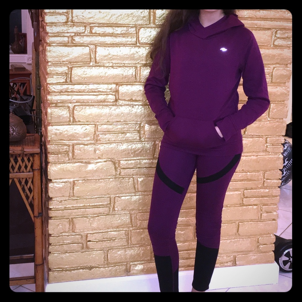 Purple legging & hoodie workout ensemble.